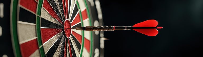 Close-up of a dart hitting the bullseye on a dartboard.