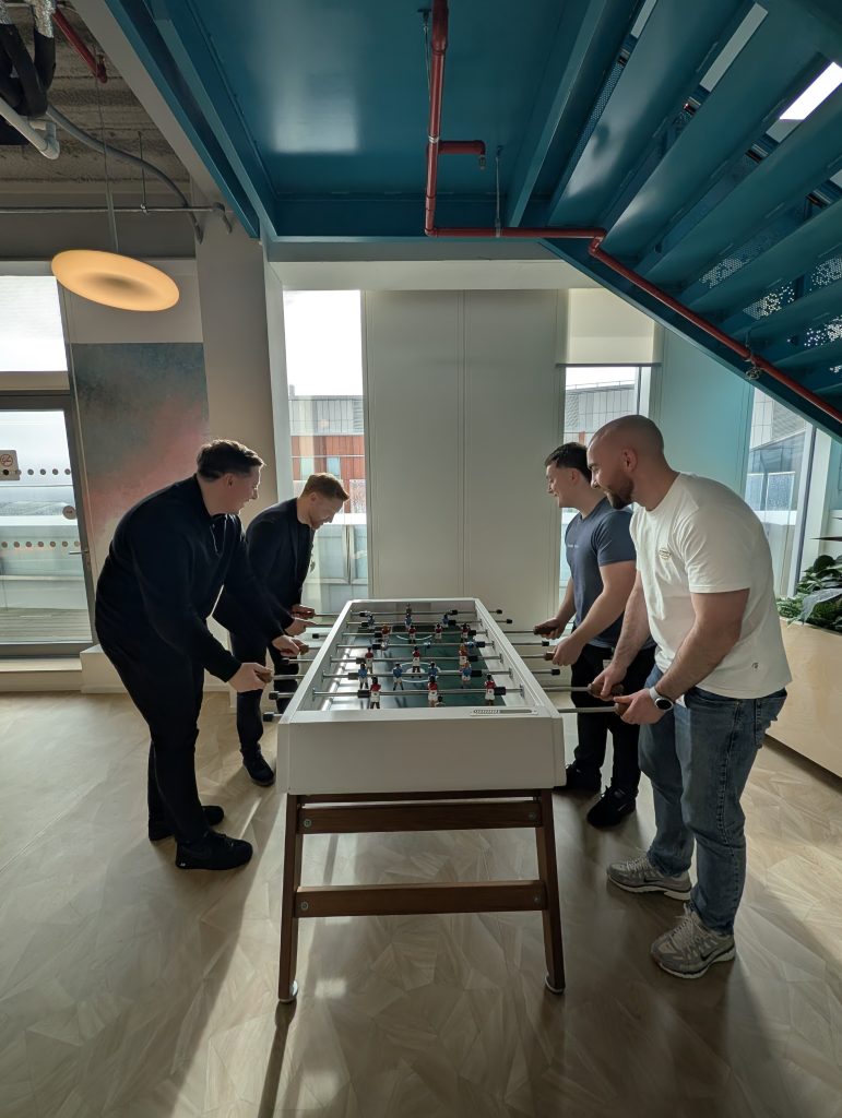 Shoptimised team playing foosball at the Google offices in Dublin