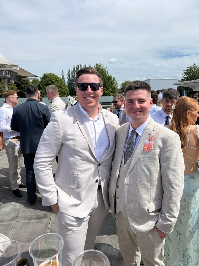 Two Shoptimised team members smartly dressed at York Races