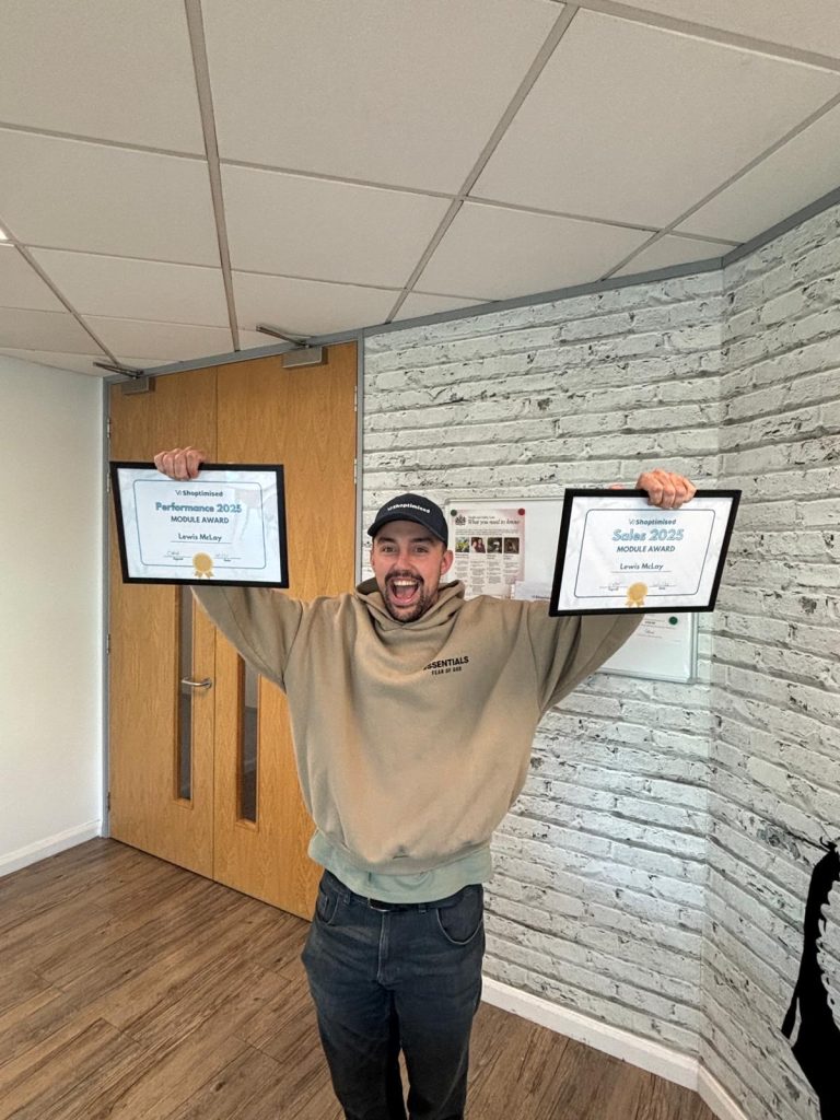 Shoptimised team members receiving awards at a workshop ceremony
