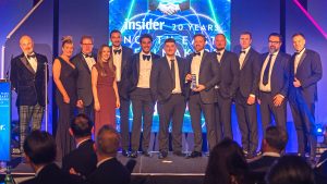 Shoptimised and LDC team members on stage after winning Deal of the Year at the Insider North East Dealmakers Awards 2026.